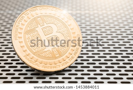 Cryptocurrency coin - Bitcoin, on background of computer lattice. 