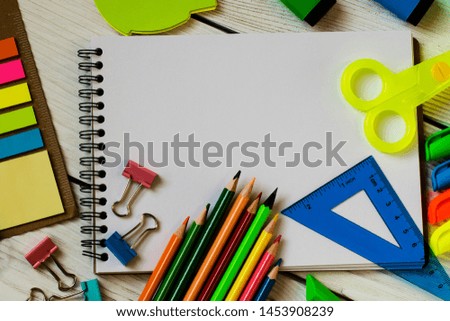 School and office supplies on a wooden background
