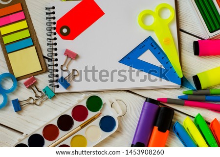 School and office supplies on a wooden background
