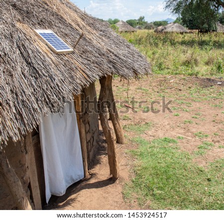 solar power panel on hut in uganda Royalty-Free Stock Photo #1453924517