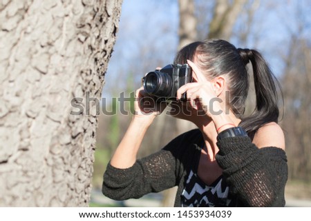 young woman taking macro photographs