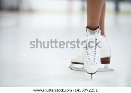 Figure Skates Close Up on Ice