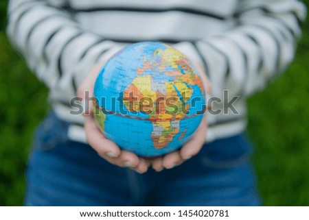 Human hands holding earth global. World environment day concept.