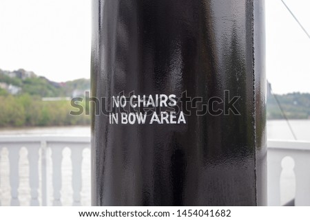 No Chairs in Bow Area Sign on a Boat.