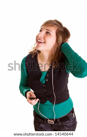 Happy teenager girl with mp3 player listening music