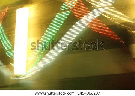 Colorful lights of urban city surrounding moving and blurred by motion