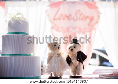wedding table decoration, pink stylized, Luxury wedding modern restaurant, bear doll on wedding reception table