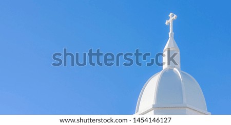 Cross on the roof of Christ Church, Chris has space blue sky blackground for text or symbol. Bangkok, Thailand