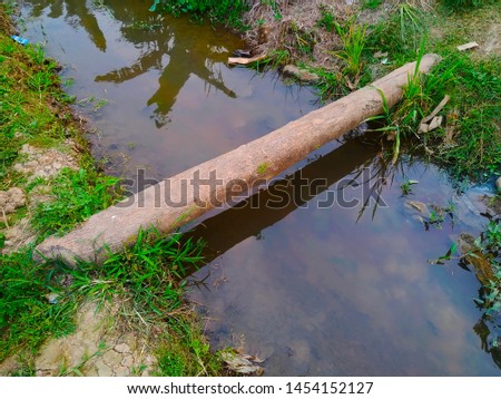 small river wooden bridge in the rice fields