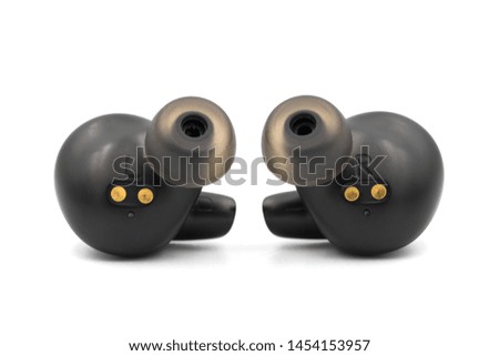 Black true wireless earbuds in isolated white background.