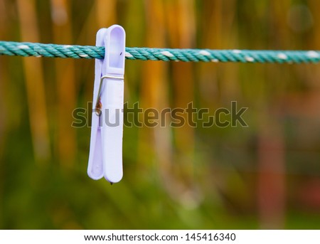 THE clothes pegs sit on a washing line