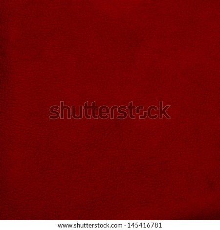 Red leather texture closeup detailed background.