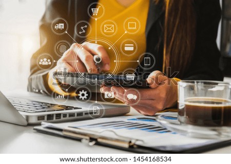 Close up of hand using tablet ,laptop, and holding mobile phone with credit card online banking payment communication network, internet wireless application development sync app, virtual graphic  icon