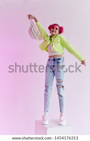 woman with pink hair with bag full-length cube