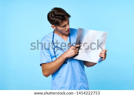 doctor looks at x-ray stethoscope