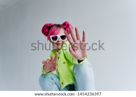 woman with pink hair with glasses retro style