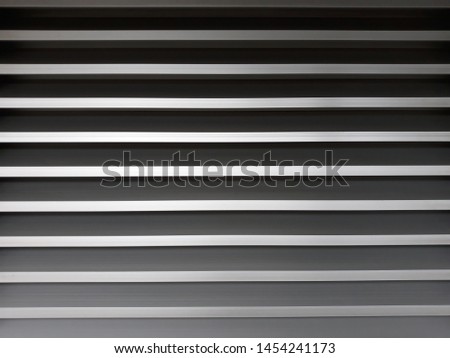 Closeup horizontal black and white metal lines for texture and background