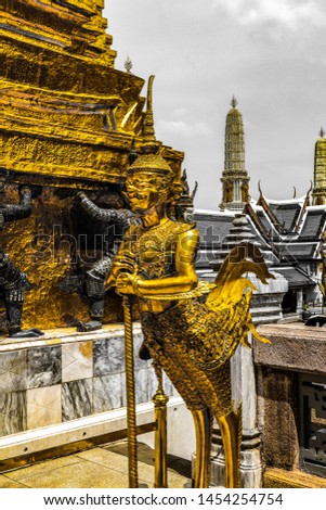 Beautiful close up color black white and 
 gold Wat Phra Kaew or Temple of Emerald Buddha, Guardian statues pagoda and Grand palace located within the grounds of the Grand Palace in Bangkok