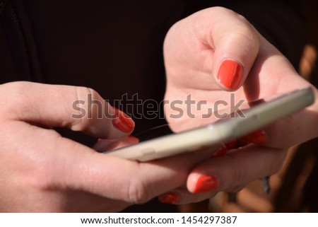 A woman checking cell phone chats