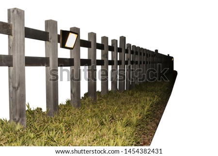 Wooden fence against lamp on white background.