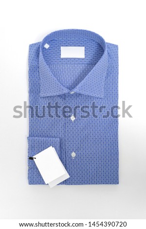 isolated folded fashionable men's shirt on white background