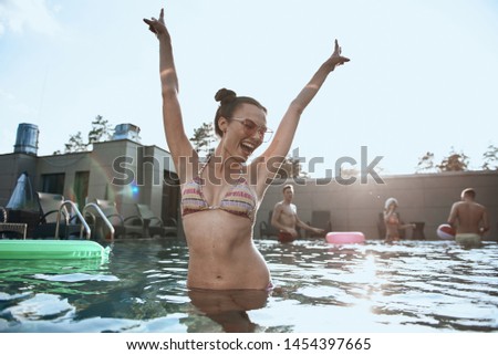 Beautiful Caucasian woman wearing sunglasses and shouting. Summertime concept
