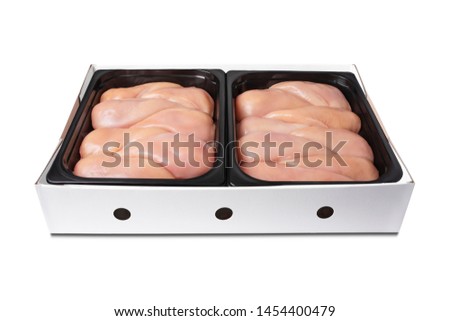 Chicken fillet. Fresh, raw chicken fillet in the package. Closeup of chicken meat. Procurement for designers. Chicken meat background. Vacuum packaging. Isolate.