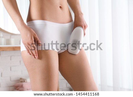 Woman doing bikini epilation procedure indoors, closeup
