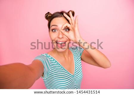 Self-portrait of her she nice-looking lovely shine charming cute cheerful cheery positive girl showing ok-sign on eye isolated over pink pastel background