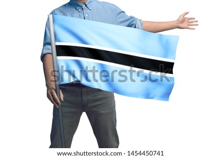 Young man holding Botswana Flag in White Background, Flag of Botswana.