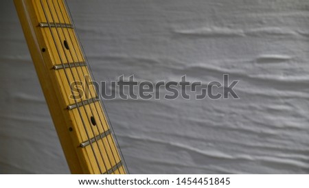   electric guitar . white wall background                             