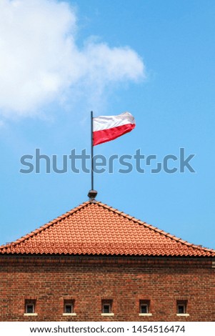 Poland flag on a blue sky background