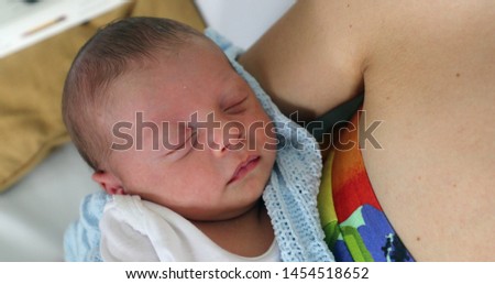 Closeup of newborn baby face in first week of life portrait
