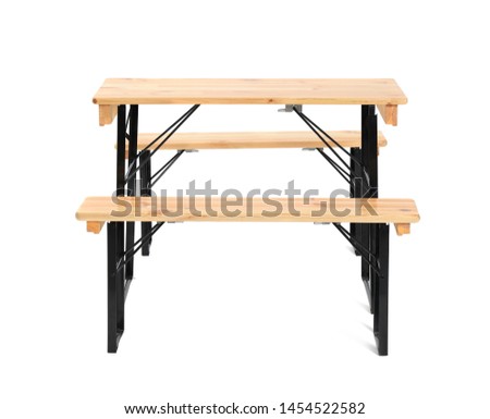 Wooden picnic table with benches isolated on white