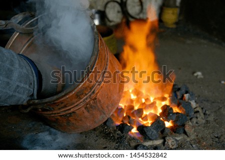 a pewter pots on fire