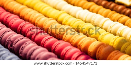Macarons assortment background texture. French store display, close up view with details, banner