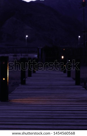 Mountains beside the sea at night photography