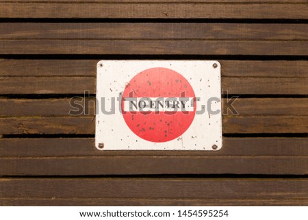 Signboard "NO ENTRY" on wooden 