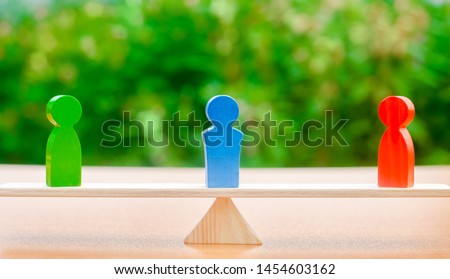 Wooden figures of people on scales and a mediator / arbitrator. Conflict of interest. Resolving conflict situations. Conclusions of the peaceful resolution of disputes. Business opponents Royalty-Free Stock Photo #1454603162
