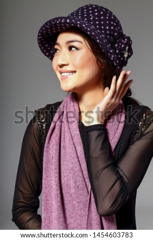 Asian girl wearing a stocking cap