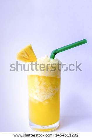 Pineapple smoothie with a piece of Pineapple on white background, healthy juices.