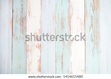 Close up of wall made of painted pastel colored wood planks, Old wooden texture background with copy space.
