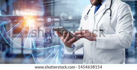 Abstract luminous DNA molecule. Doctor using tablet and check with analysis chromosome DNA genetic of human on virtual interface. Medicine. Medical science and biotechnology.
    
    - Image