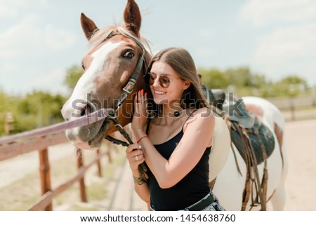 beautiful girl with a horse
