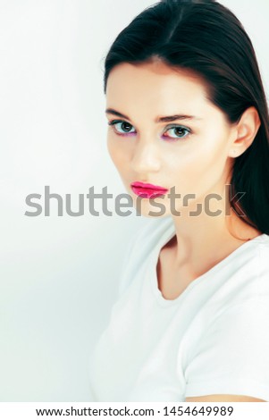 young pretty teenage girl posing emotional happy smiling on white background, lifestyle people concept