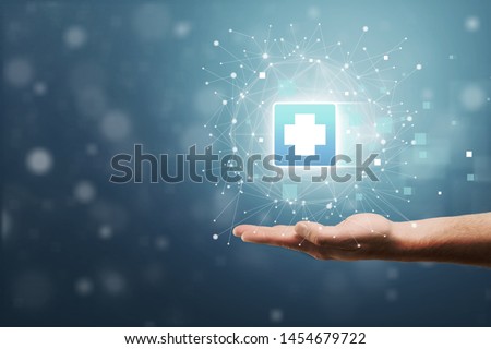 Hand holding plus sign virtual means to offer positive thing (like benefits, personal development, social network, health insurance) with copy space
    
    - Image