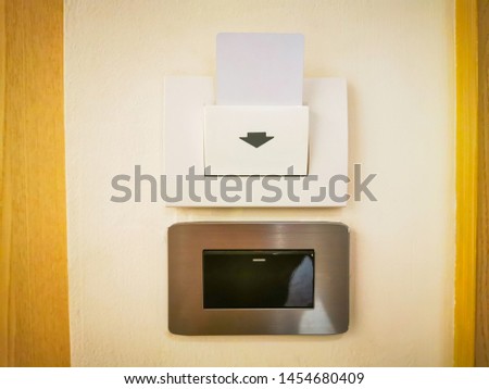 Insert key card in electronic lock in hotel. Key Card Into Hotel Room Door Lock.