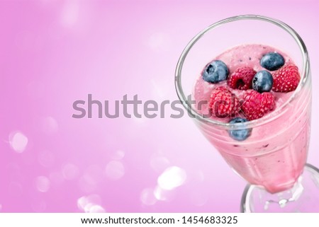 Glass of blueberry smoothie isolated on white background