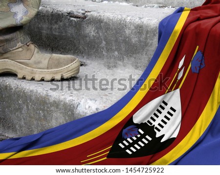 Military concept on the background of the flag of Swaziland