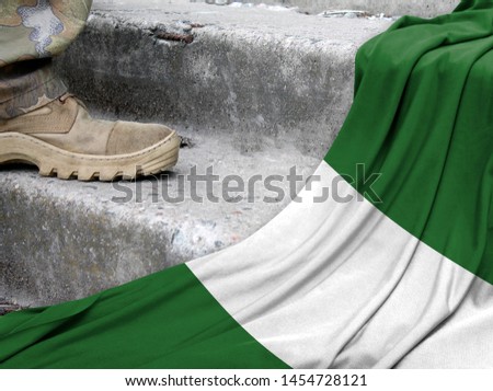 Military concept on the background of the flag of Nigeria